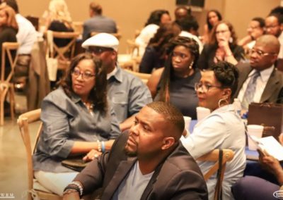 Group of People Listening to a Speaker